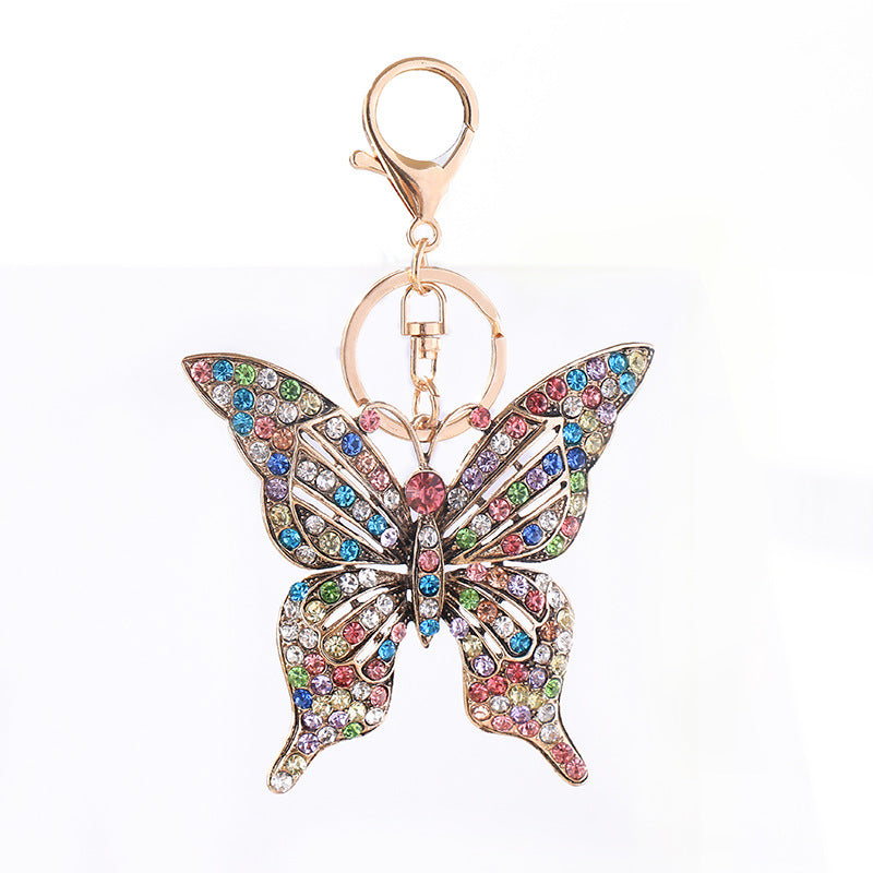 Wholesale color diamond hollow butterfly metal keychain pendant creative small gift bag pendant spot