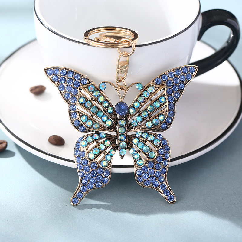 Wholesale color diamond hollow butterfly metal keychain pendant creative small gift bag pendant spot