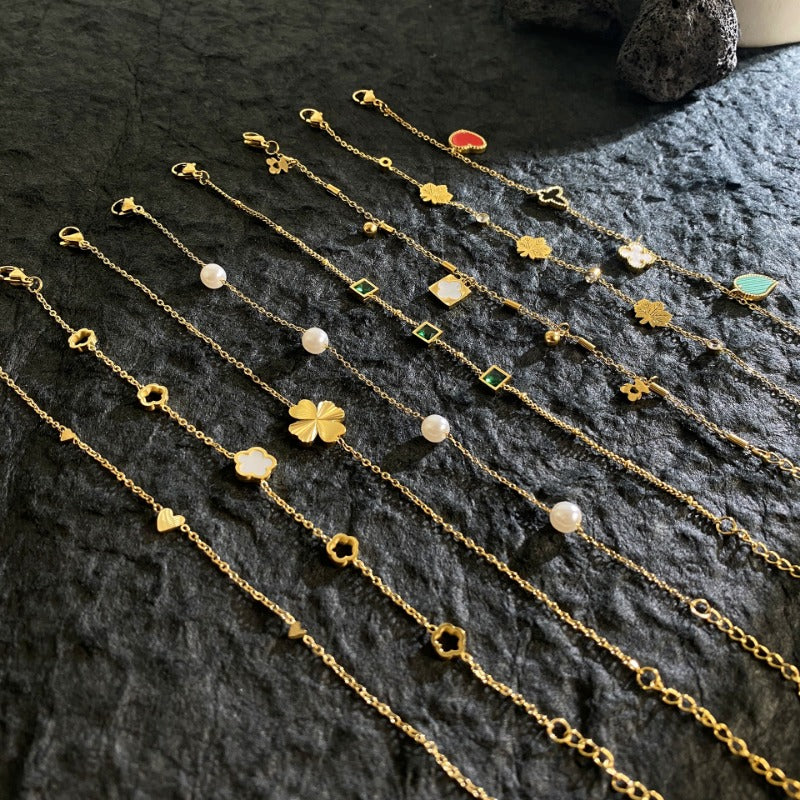 Wholesale Titanium Steel Gold Plated Laser Four Leaf Clover Pearl Bracelet ACC-BT-YuXun005