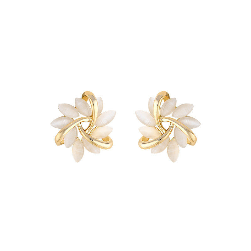 Wholesale S925 Silver Needle Rotating Flower Cat's Eye Stone Sun Earrings