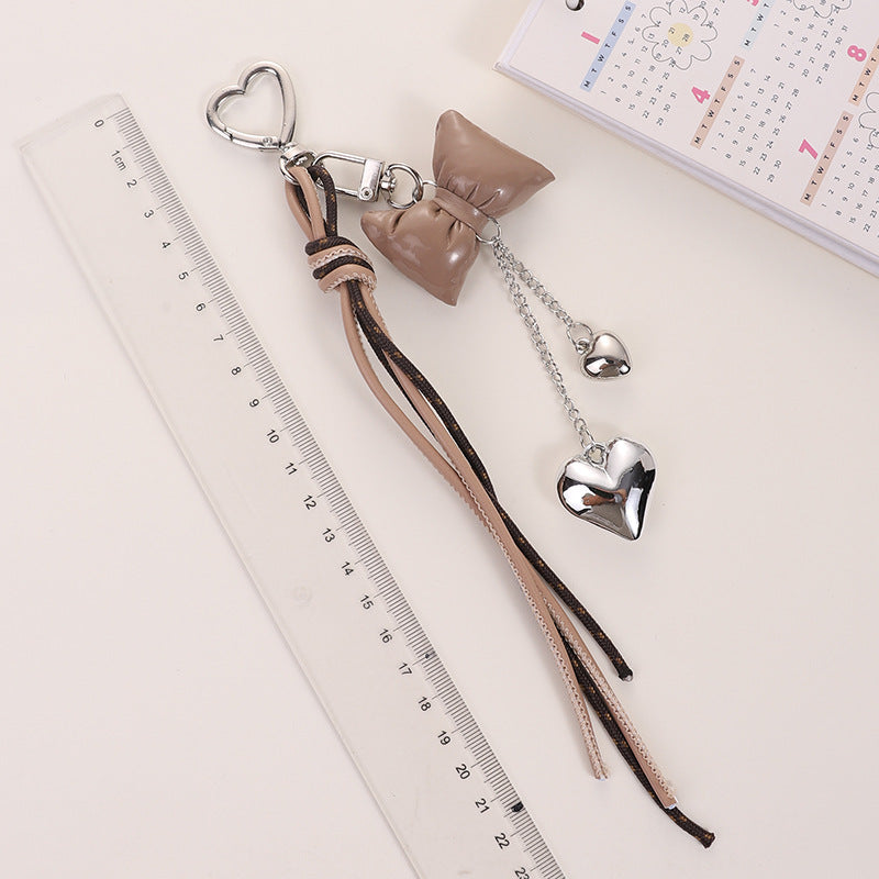 Wholesale Leather cord bow tassel keychain