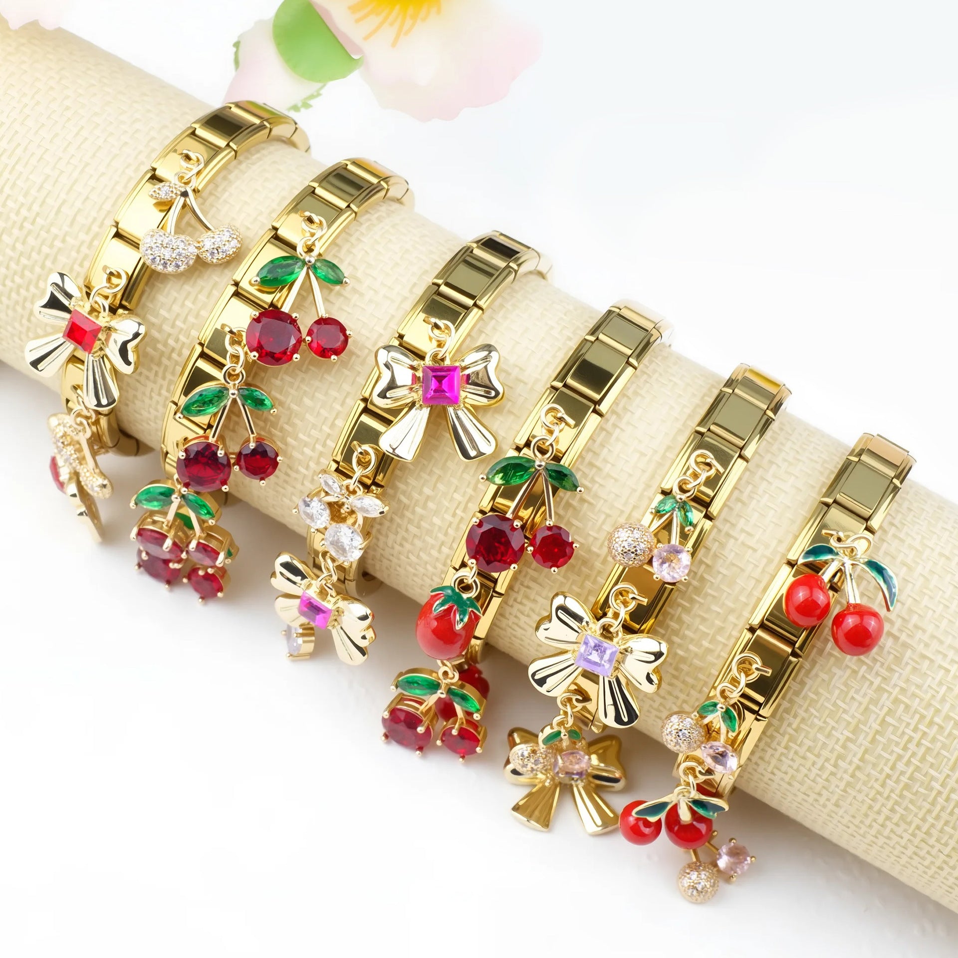 Gold-tone Italian-style modular bracelet decorated with dangling cherry charms