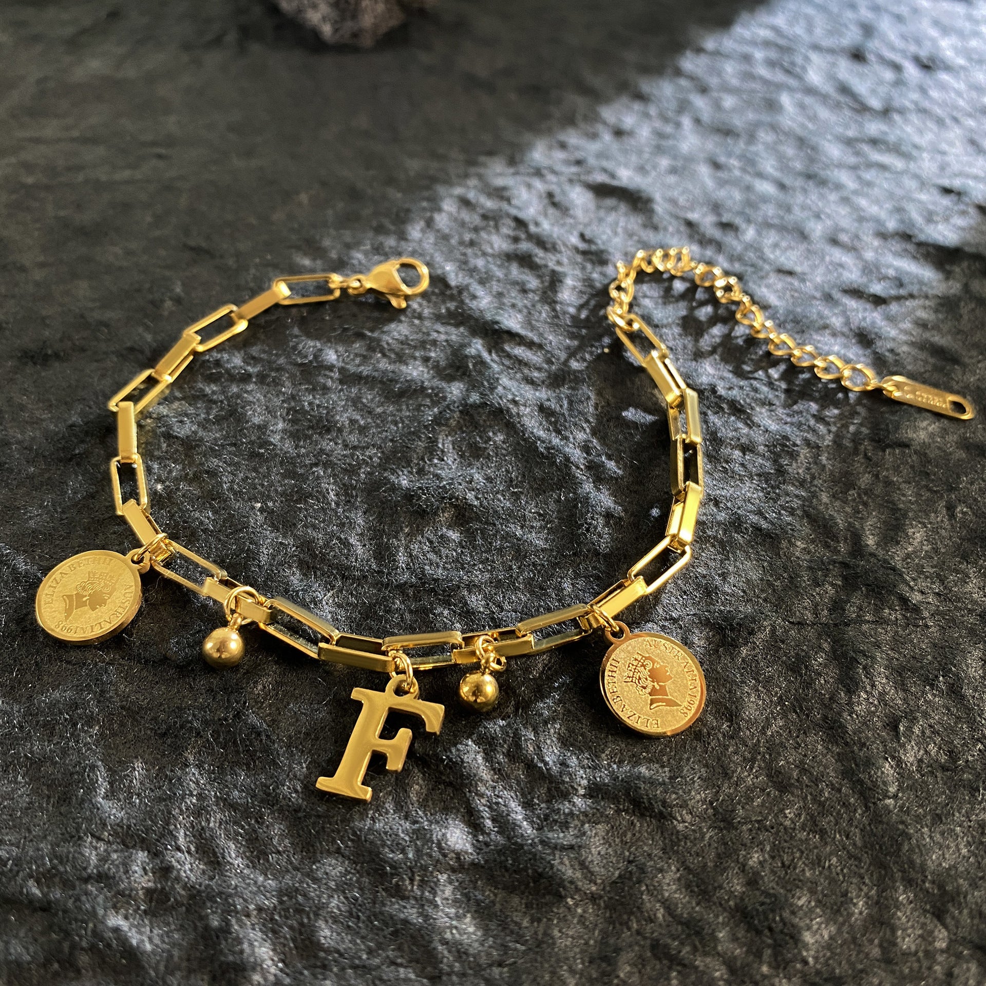 Wholesale Titanium Steel 18K Gold Plated Queen's Head Letter Bracelet ACC-BT-YuXun007