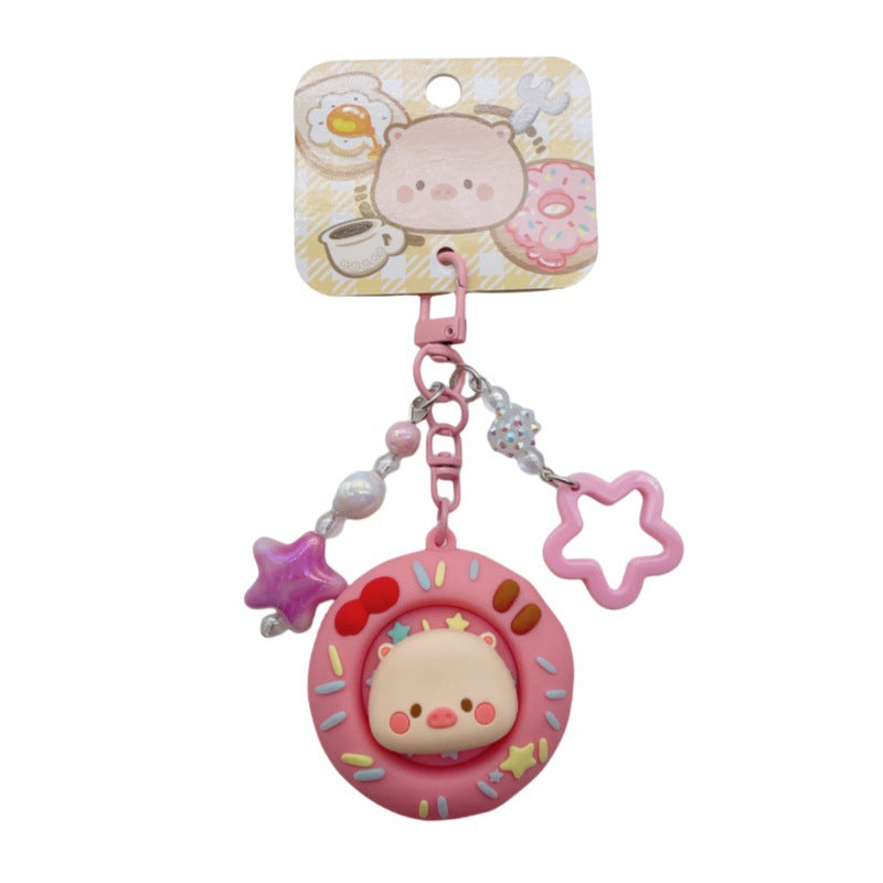 Wholesale Cute cartoon PVC pig spinning donut keychain