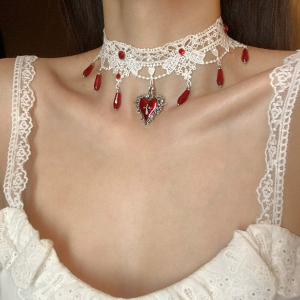 Collana a goccia con cuore e croce con goccia di sangue all'ingrosso