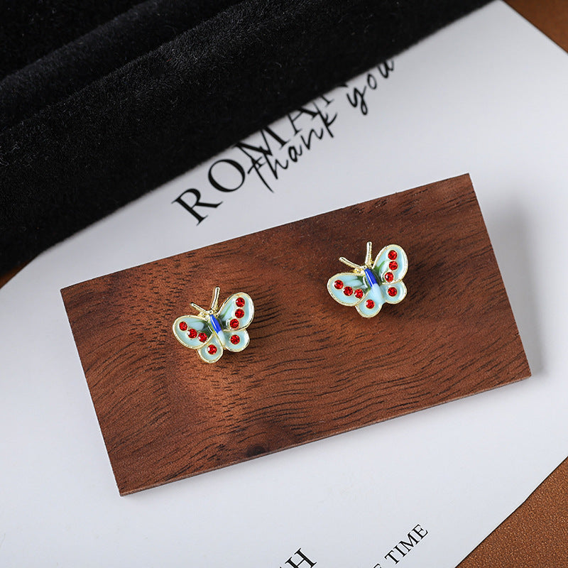 Wholesale drip glaze blue small butterfly diamond earrings