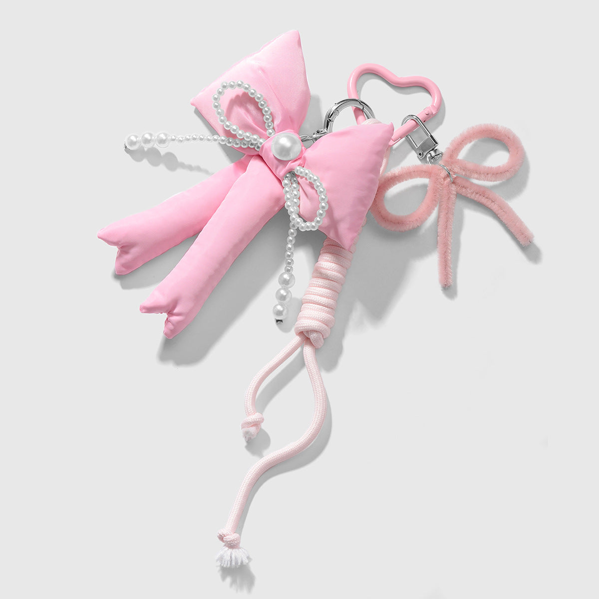 Wholesale Zinc alloy pink twistable stick bowknot and heart-shaped keychain