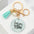 Wholesale MOM tassel pearl resin round card keychain