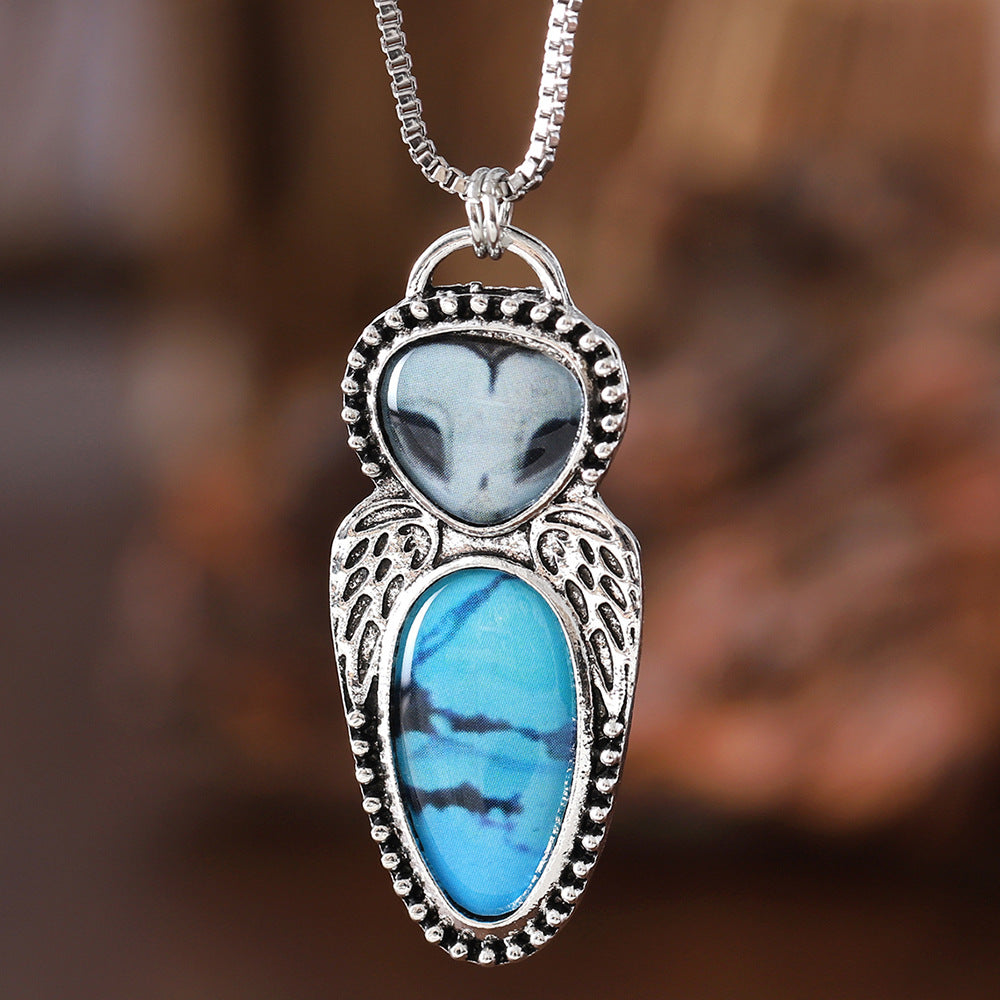 Wholesale Creative punk style owl pendant necklace featuring turquoise inlay and alloy construction.