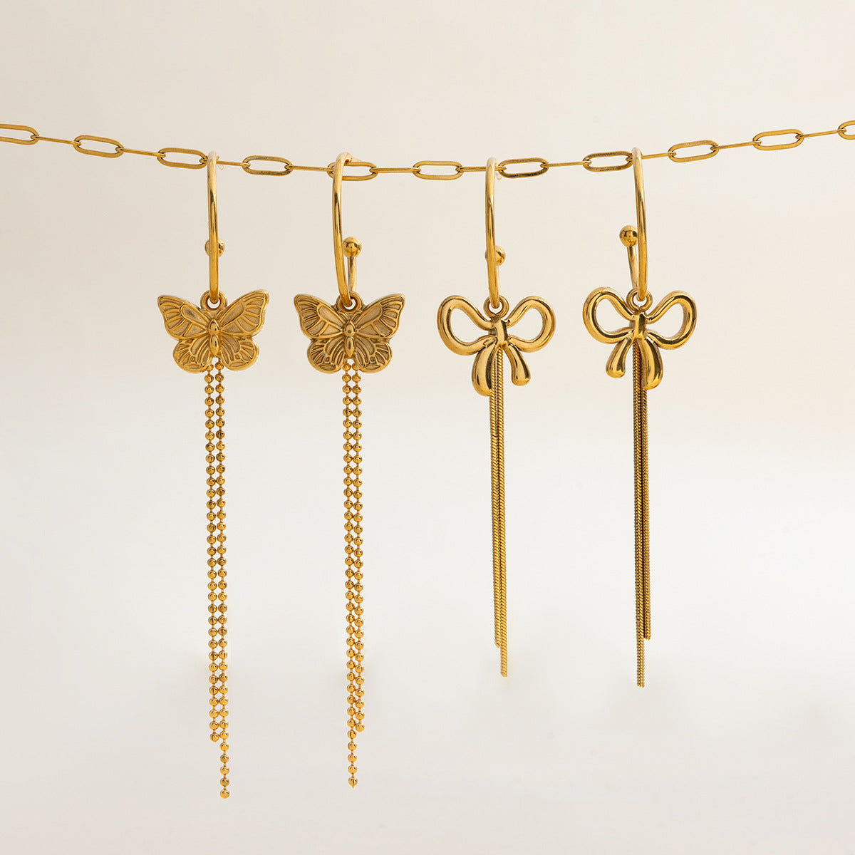 Wholesale Bohemian 18K gold stainless steel bow tassel C-shaped earrings