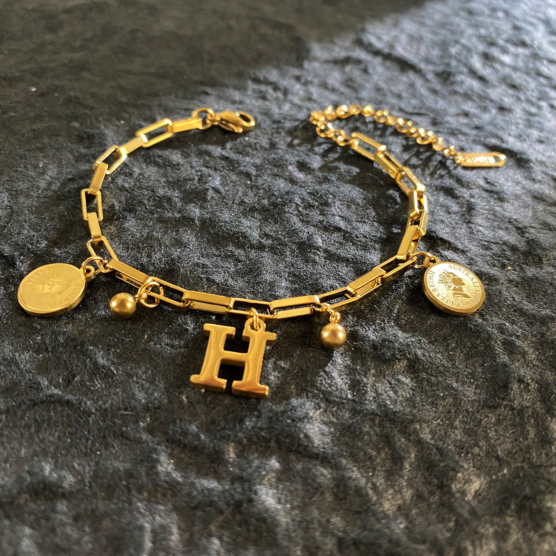 Wholesale Titanium Steel 18K Gold Plated Queen's Head Letter Bracelet ACC-BT-YuXun007