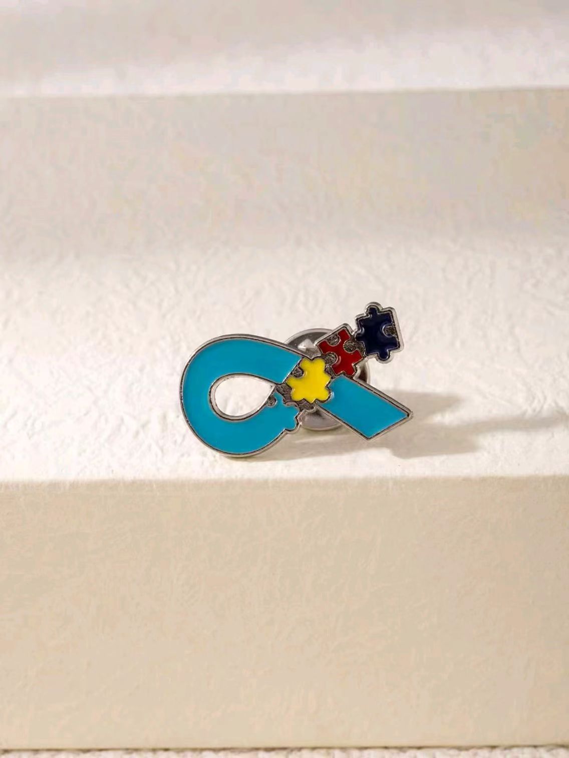 Wholesale Color-block puzzle brooch to support autism