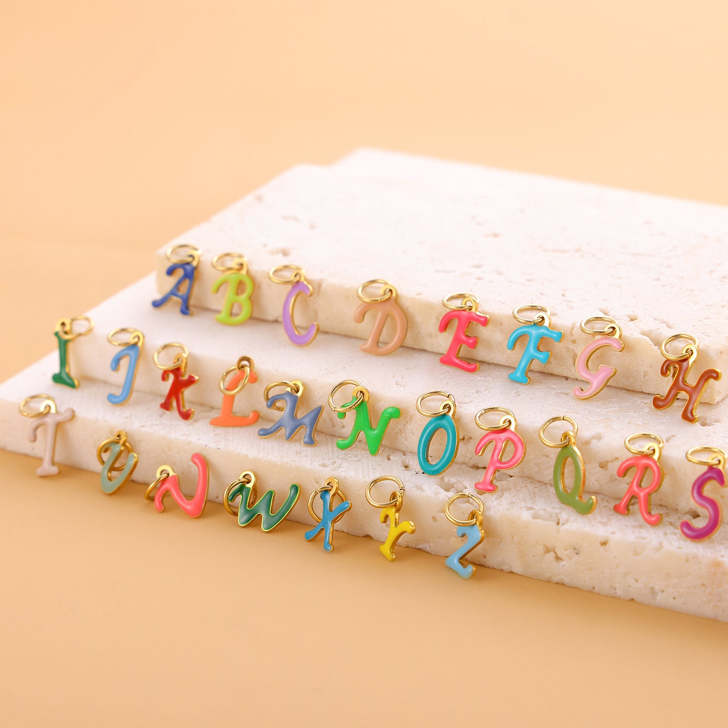 Wholesale Colorful 26 English letter pendant oil drop titanium steel vacuum plating pendant