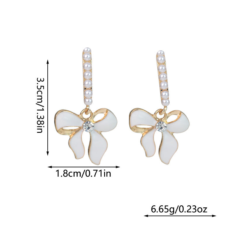 Wholesale White Bow Inlaid Pearl S925 Silver Needle Alloy Earrings ACC-ES-RuLong009