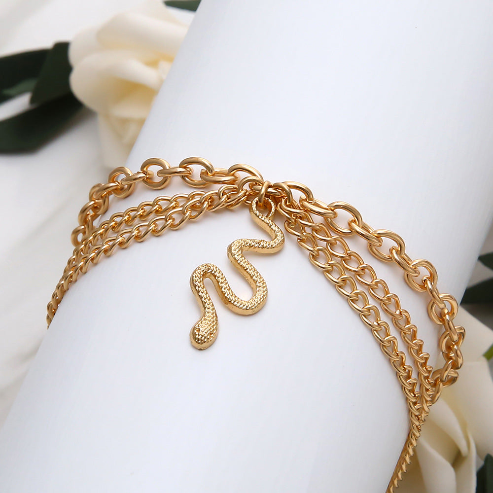 Wholesale Alloy Golden Cross Tassel Snake Pendant Three Layer Anklet for Women