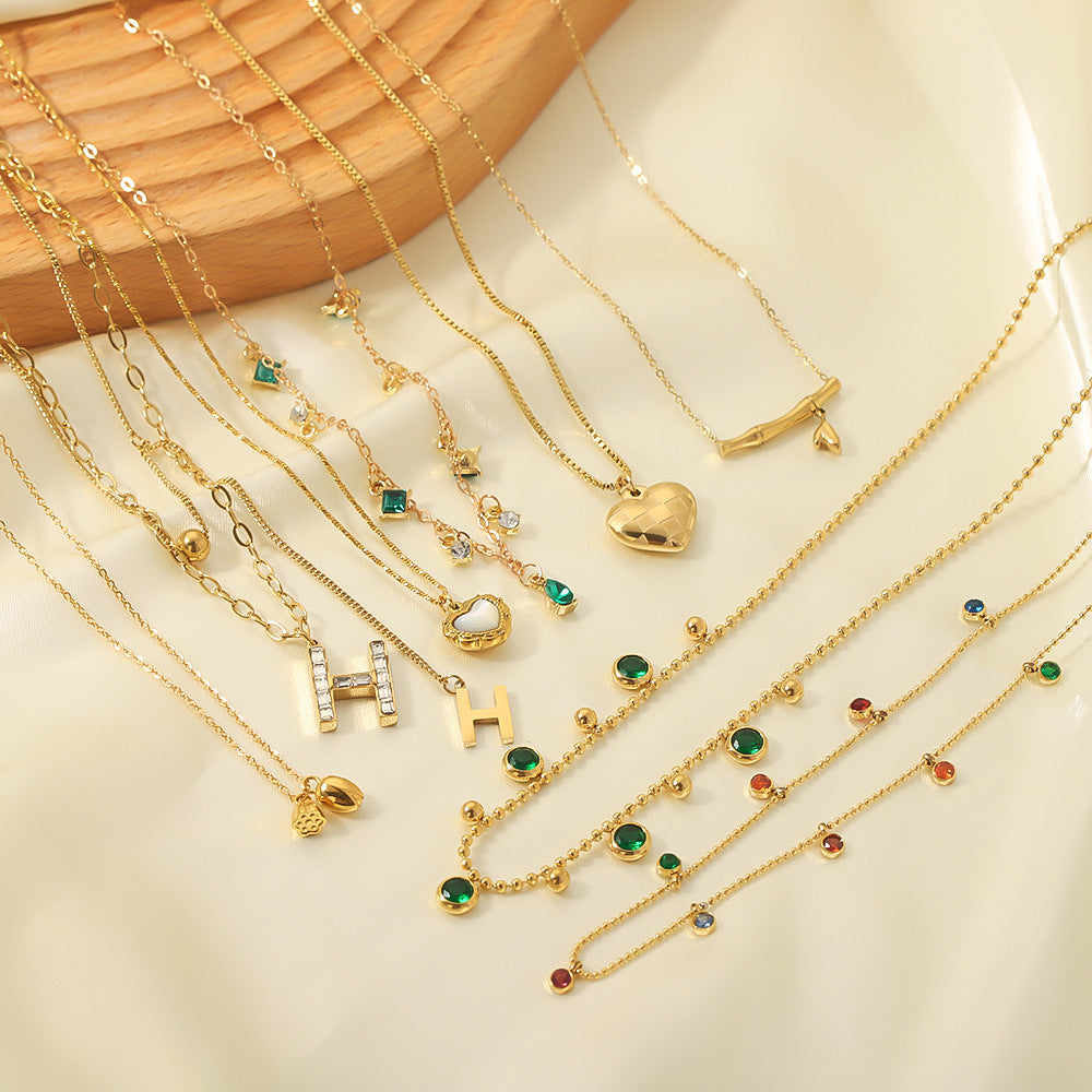 Wholesale stainless steel bamboo love fishtail skirt letter zircon necklace