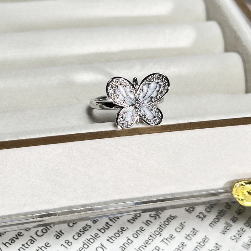 Wholesale White Drop Glaze Butterfly Saturn Fashion Ring