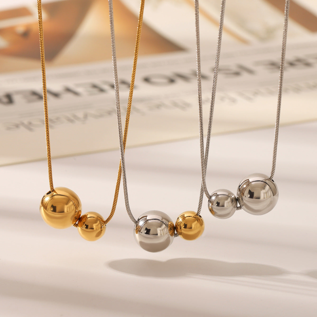 Wholesale Titanium steel necklace with gold and silver color matching round bead pendant