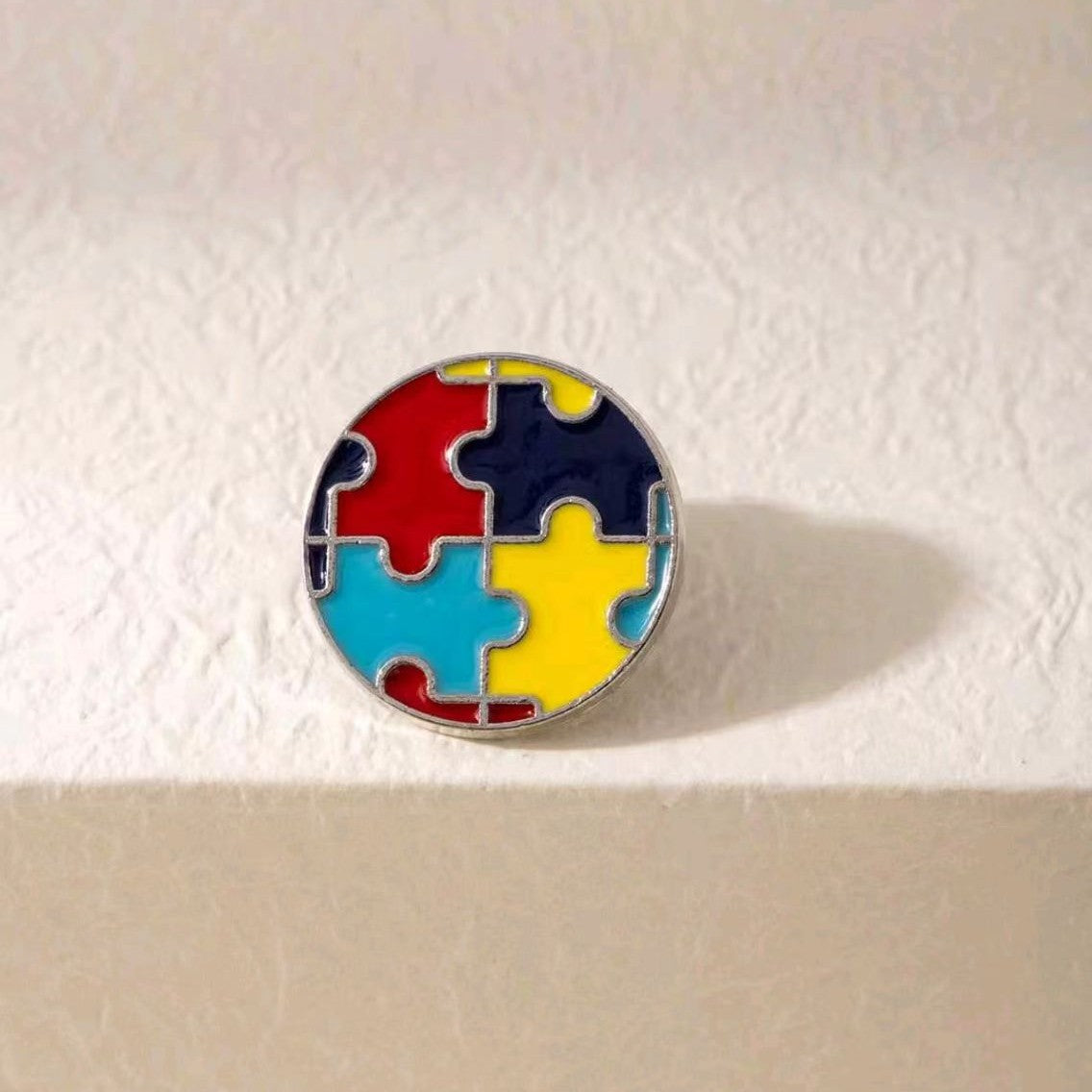 Wholesale Color-block puzzle brooch to support autism