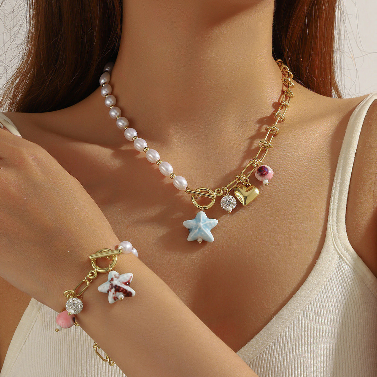 Wholesale  best-selling trendy pearl heart necklace and bracelet set for women  featuring a luxurious and sophisticated ocean-themed design