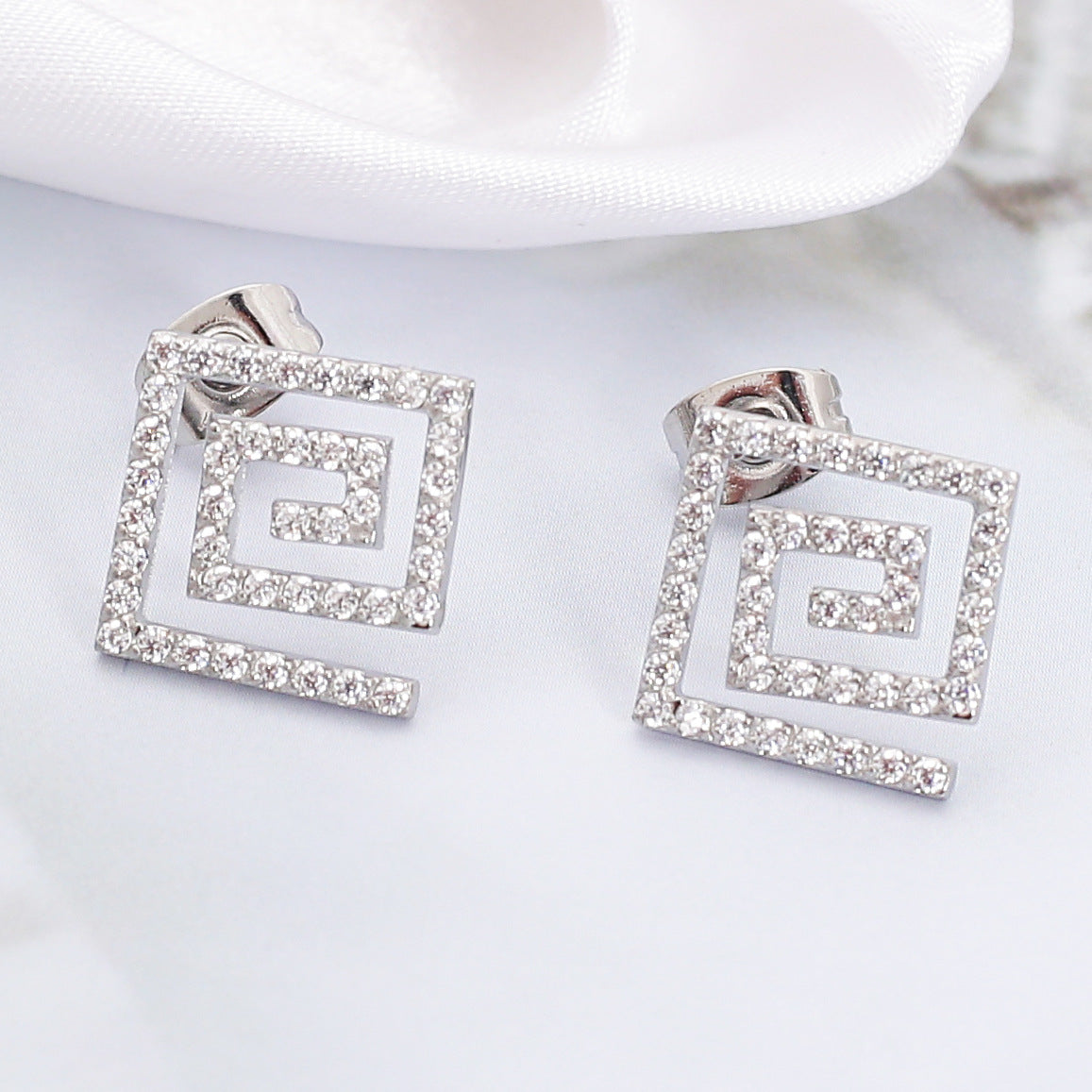 Wholesale Stainless steel earrings with zircon settings