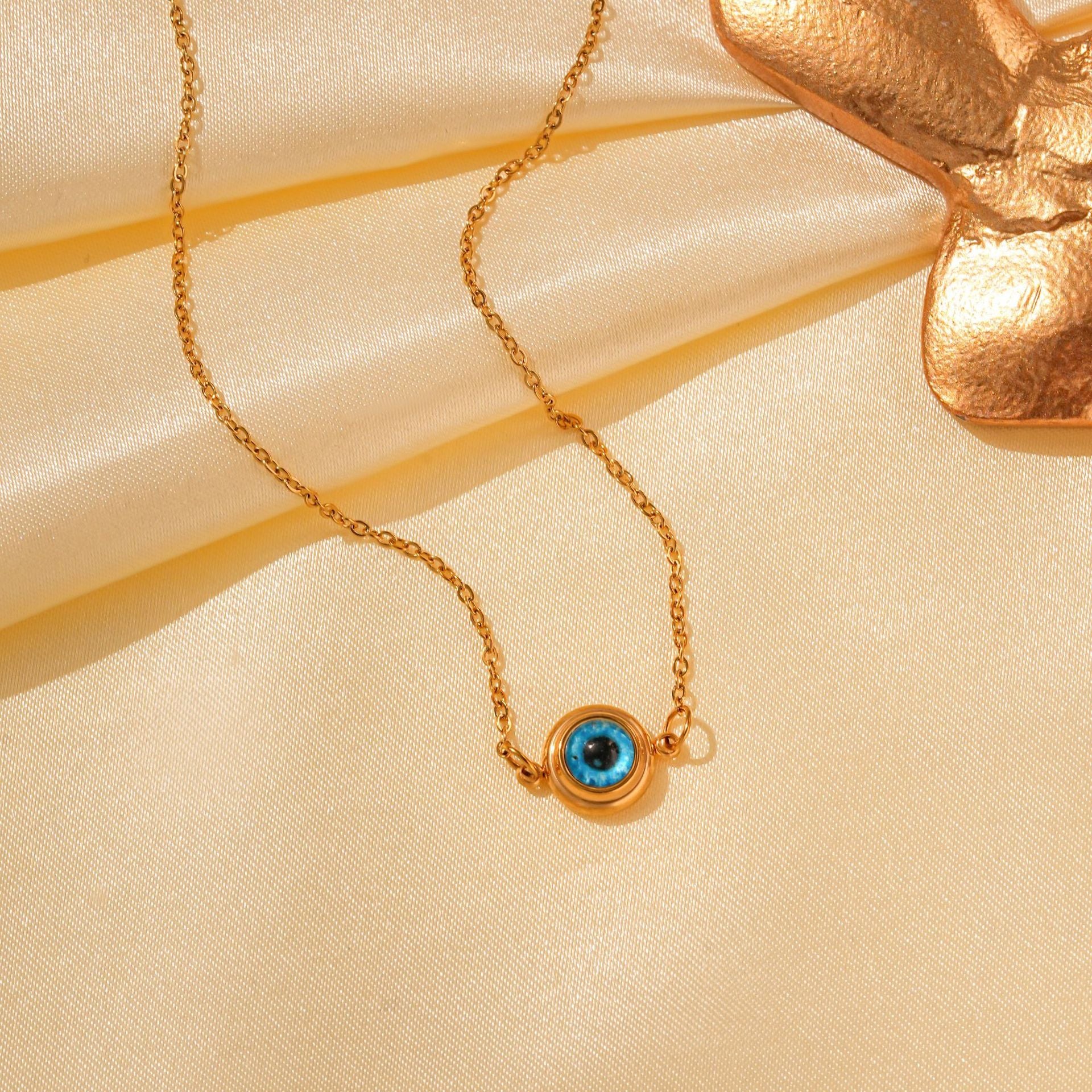 Wholesale Titanium Steel Retro Hip-hop Blue Devil's Eye Bow Love Pendant Evil Eye Necklace