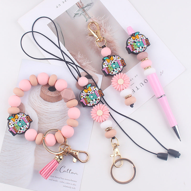 Wholesale Cartoon Teacher's Day Apple Silicone Accessories Pendant Creative DIY Four-Piece Combination Wrist Keychain