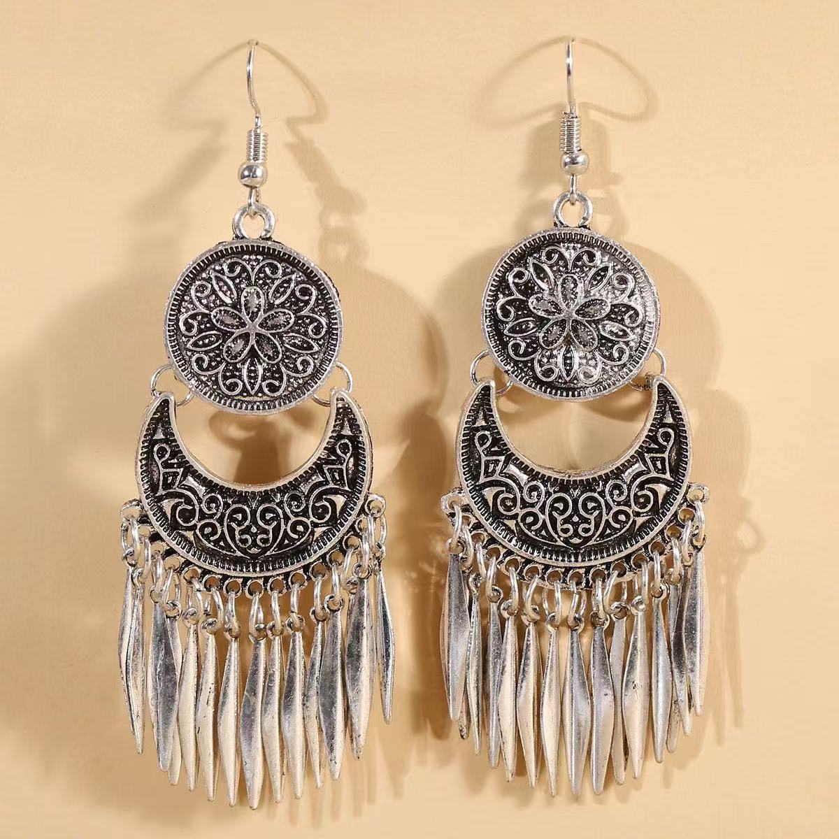 Wholesale Bohemian hollow  carved long tassel earrings