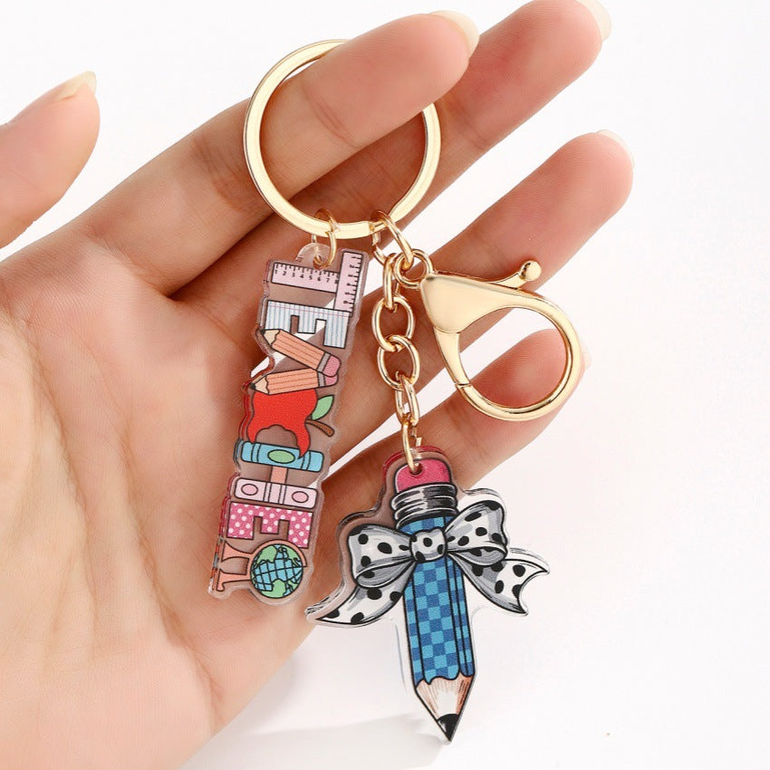 Wholesale acrylic bow pencil letter strip keychain pendant