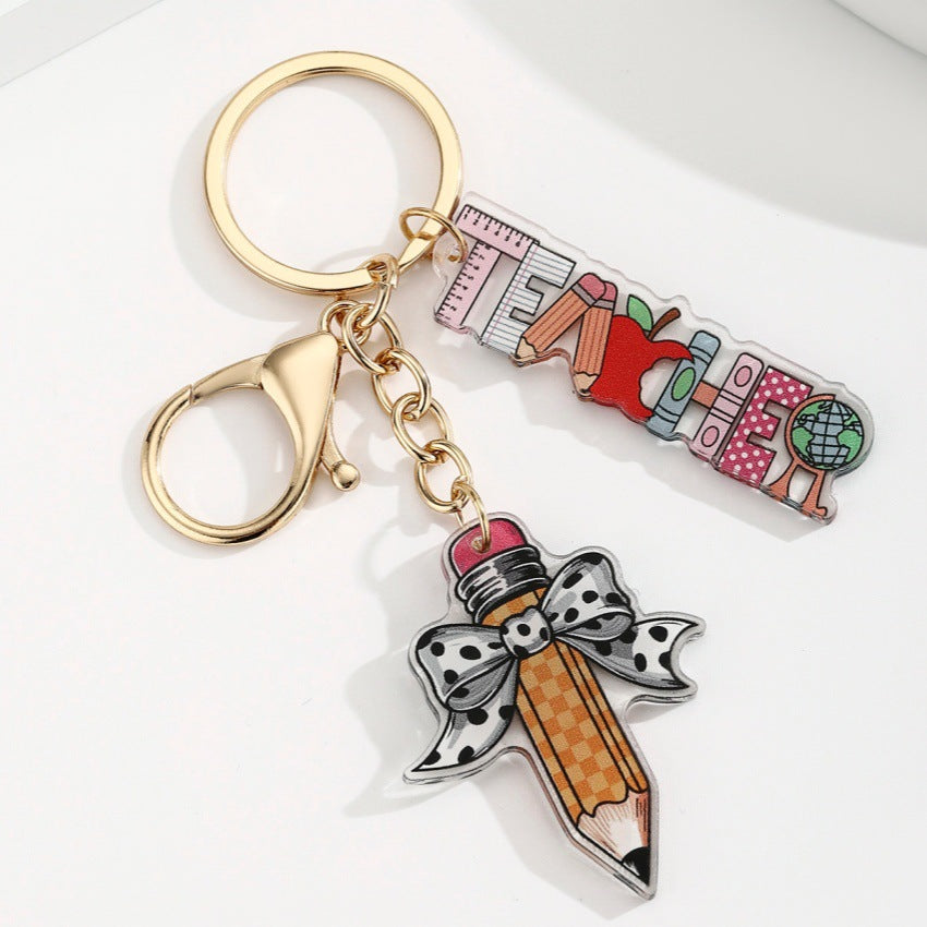 Wholesale acrylic bow pencil letter strip keychain pendant