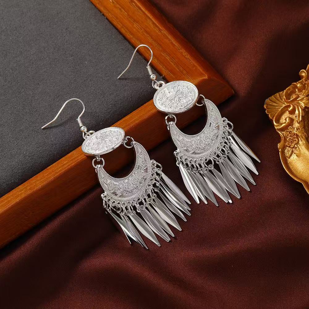 Wholesale Bohemian hollow  carved long tassel earrings