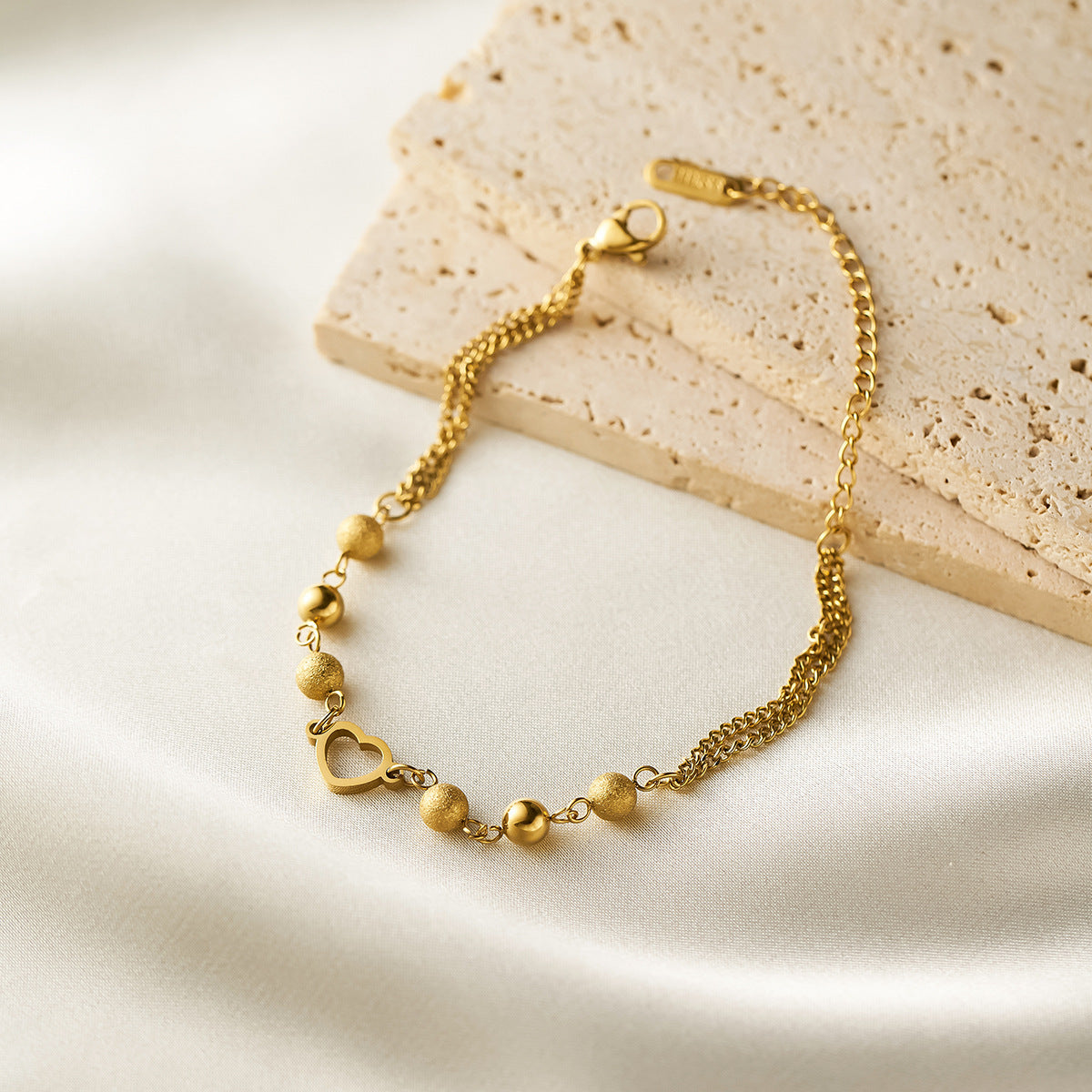 Wholesale Women's hollow heart titanium steel bracelet