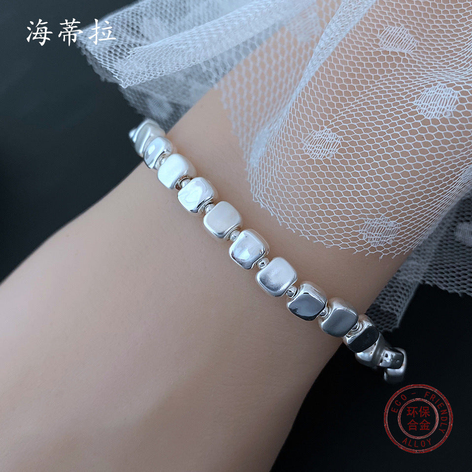 Wholesale small square grain three-color stitching alloy bracelet