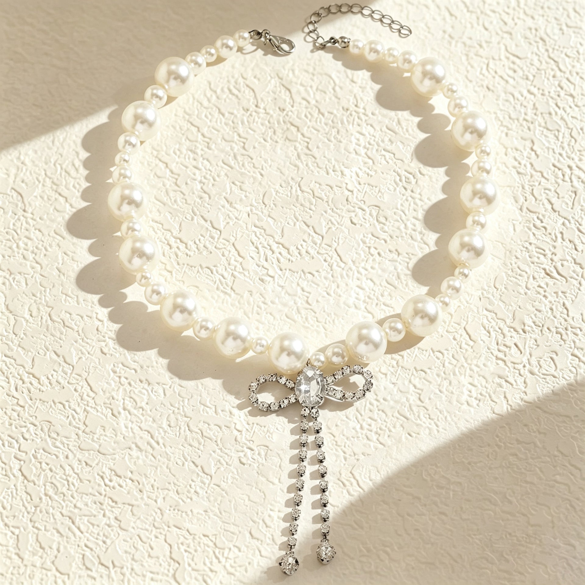 Wholesale Imitation Pearl Bow Tie Rhinestone Tassel Choker Necklace Fashion Accessory Boutique Resale