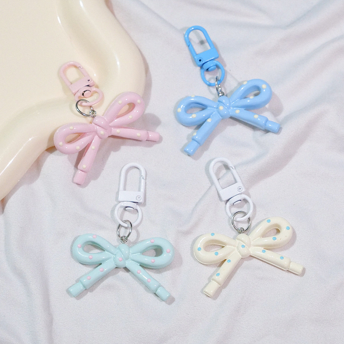 Wholesale Hollow Candy Colored Resin Bow Keychain Pendant,  Modern Bag Charm for Backpack