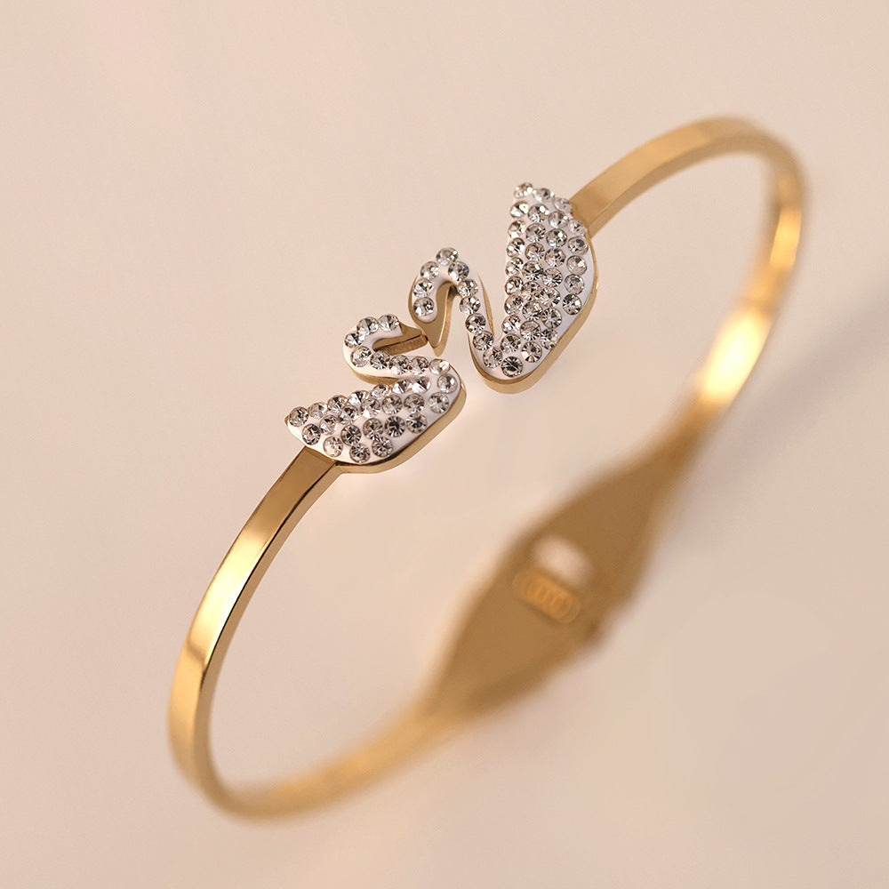 Wholesale Europe and the United States cross-border wholesale four-leaf clover women' s high-grade female non-fading jewelry gold plated swan titanium steel bracelet ACCVIP