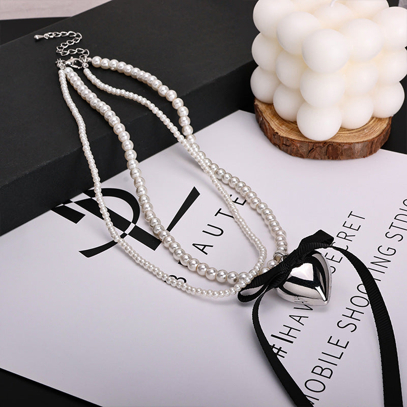 Wholesale Pearl Long Woolen Chain Love Pendant Flannel Bow Necklace