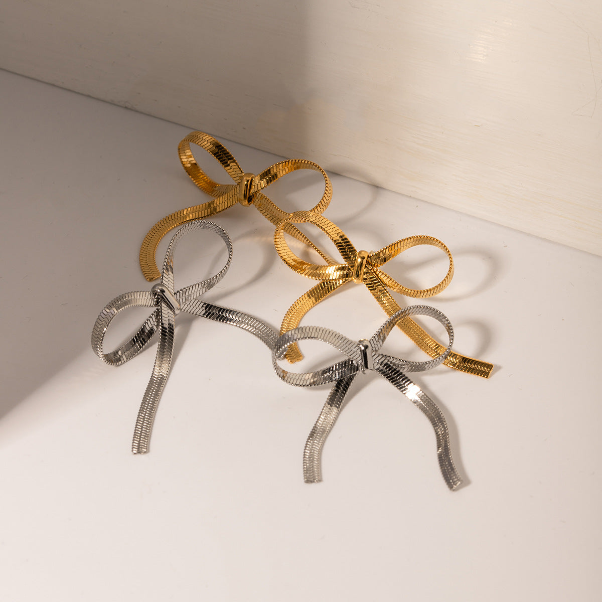 Wholesale 18k Gold Stainless Steel Earrings Flat Snake Chain Bow Earrings ACC-ES-Wanx001