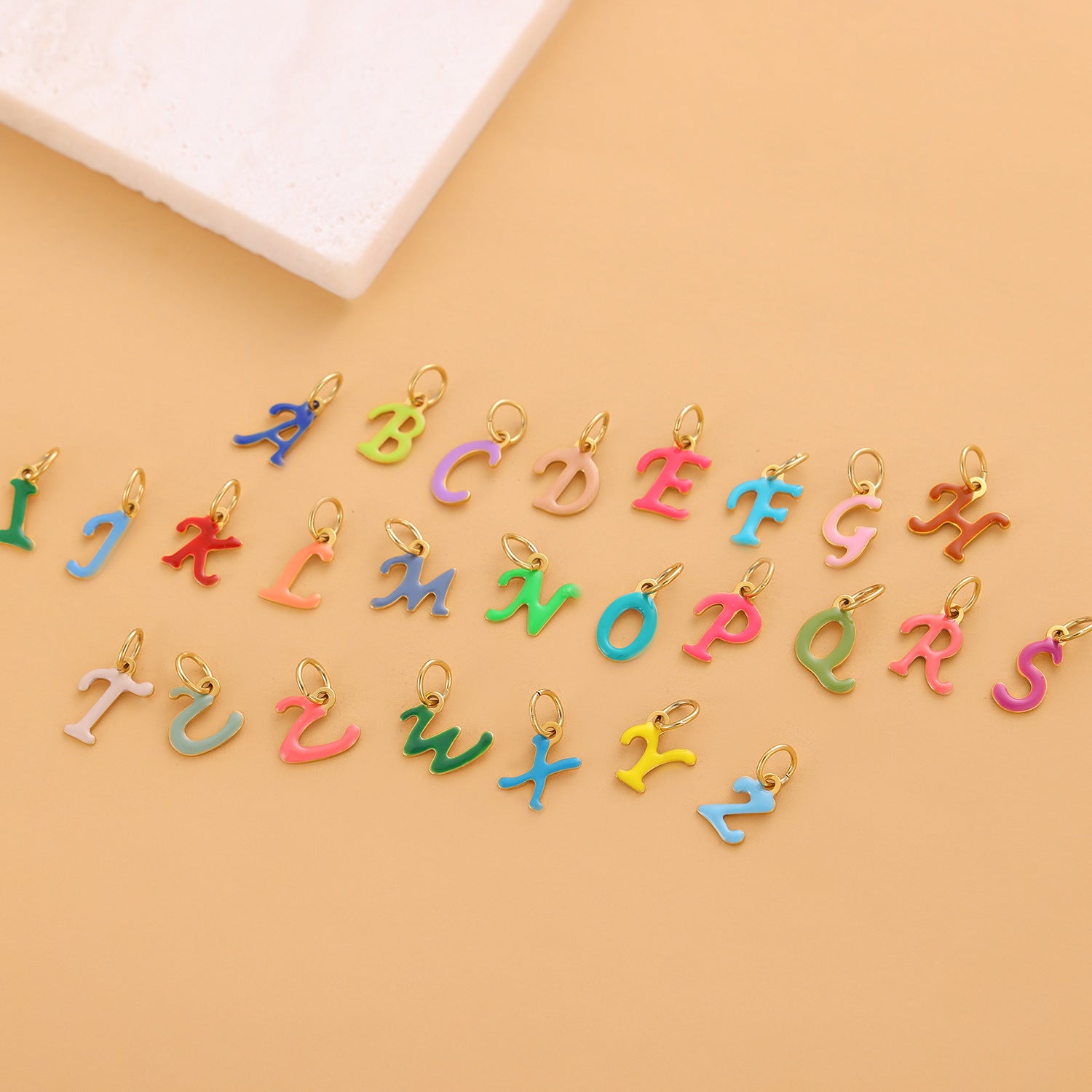 Wholesale Colorful 26 English letter pendant oil drop titanium steel vacuum plating pendant