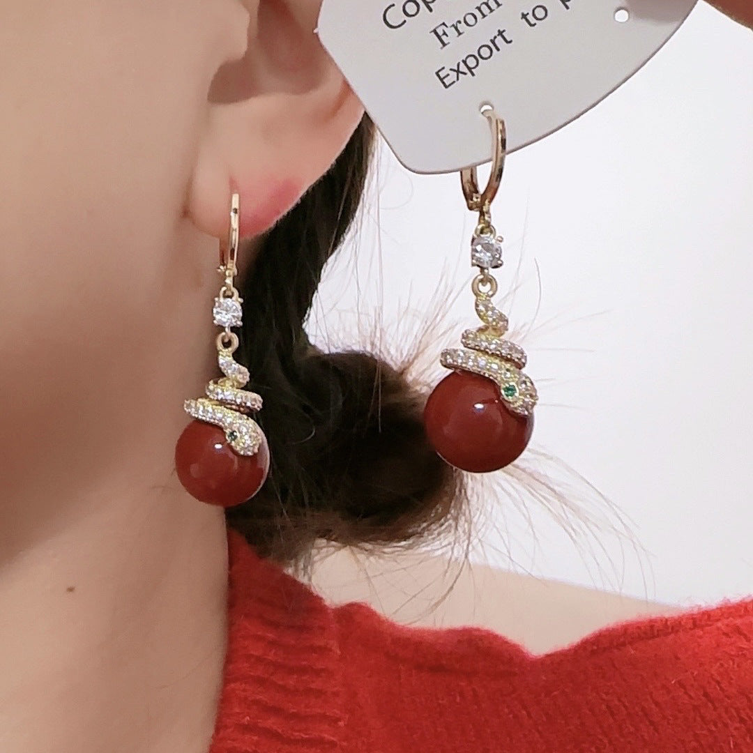 Wholesale Purple Pearl Snake Light Luxury Earrings