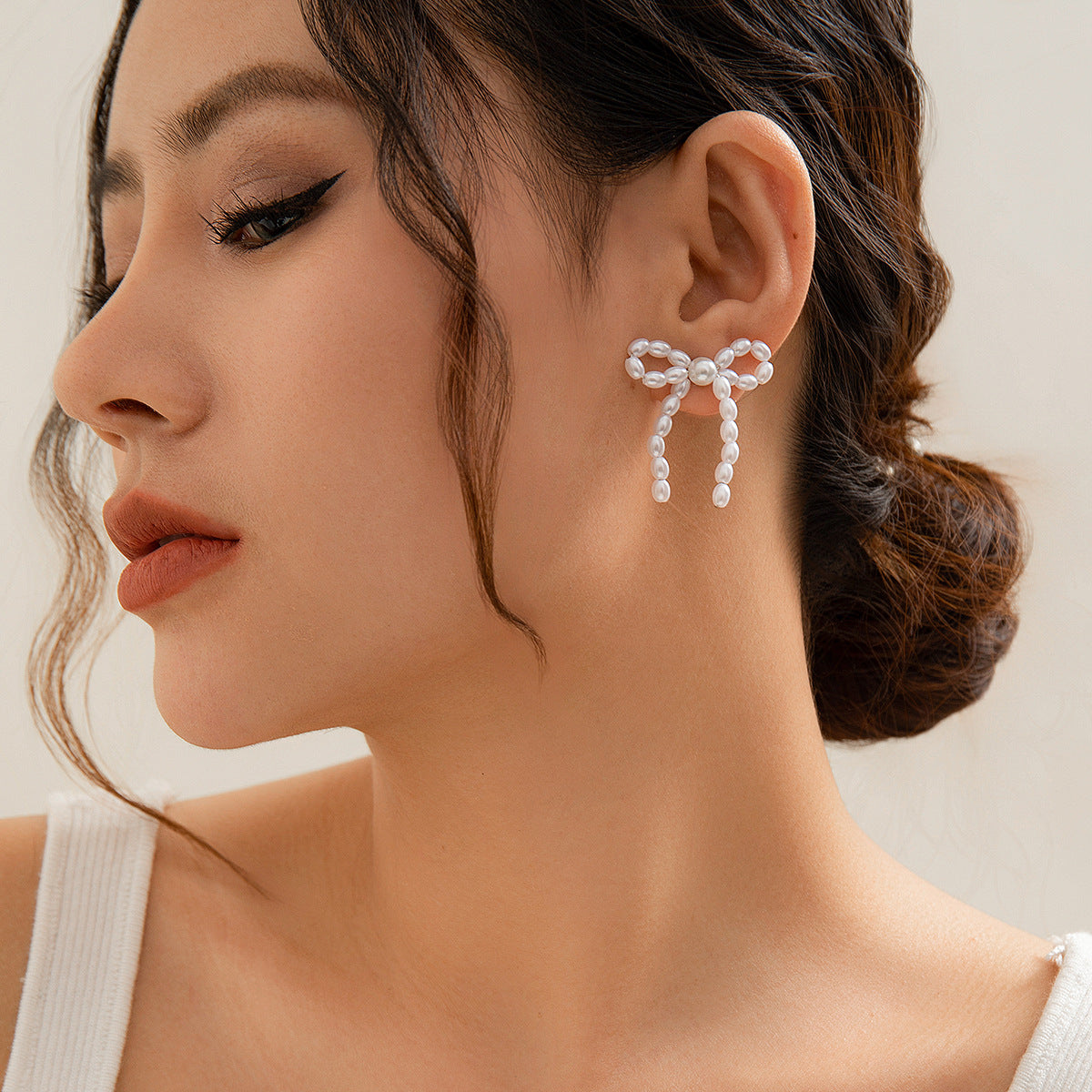 Wholesale Bow Earrings Metal Ribbon Knotted Ear Studs ACC-ES-KunJuan001