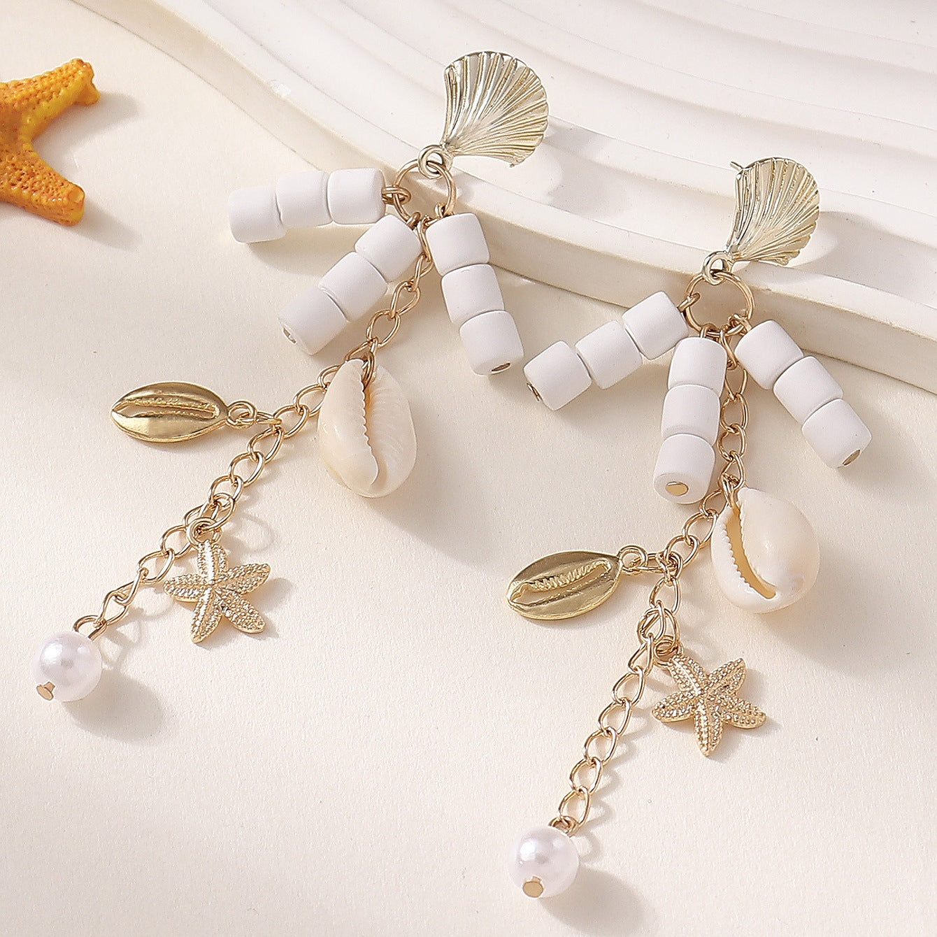 Wholesale Bohemian beach style ocean shell starfish pearl light luxury earrings