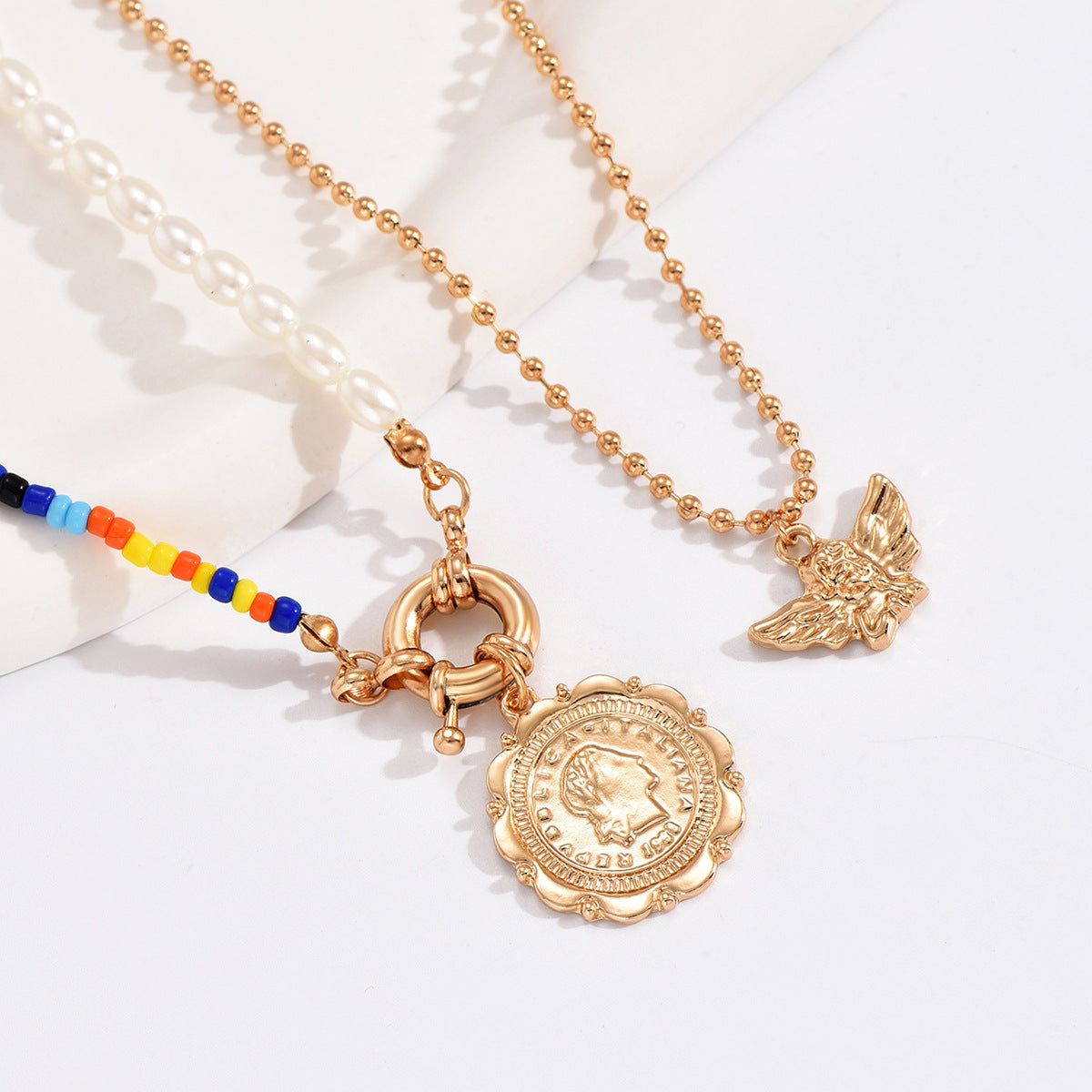 Wholesale multi-layered round angel wing pendant necklace