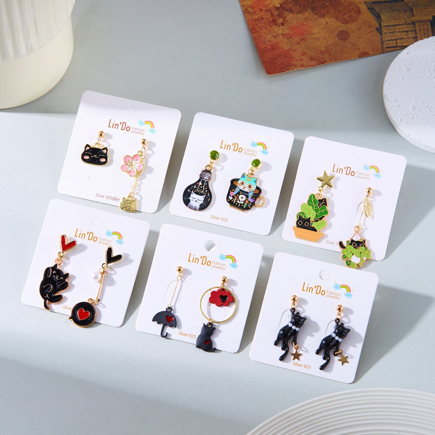 Wholesale Oil-dripped cat flower asymmetrical earrings