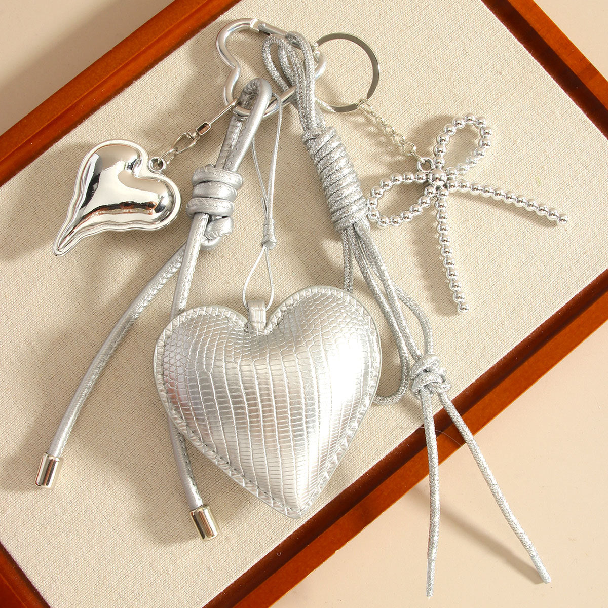 Wholesale PU leather heart-shaped bowknot woven rope bag keychain