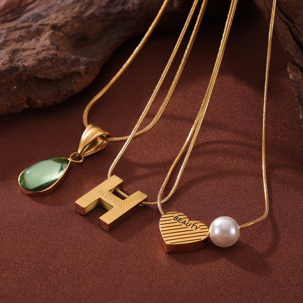 Wholesale Retro Love Water Drop Glass Stone Pendant Titanium Steel Gold Plated Necklaces ACC-NE-OMK007