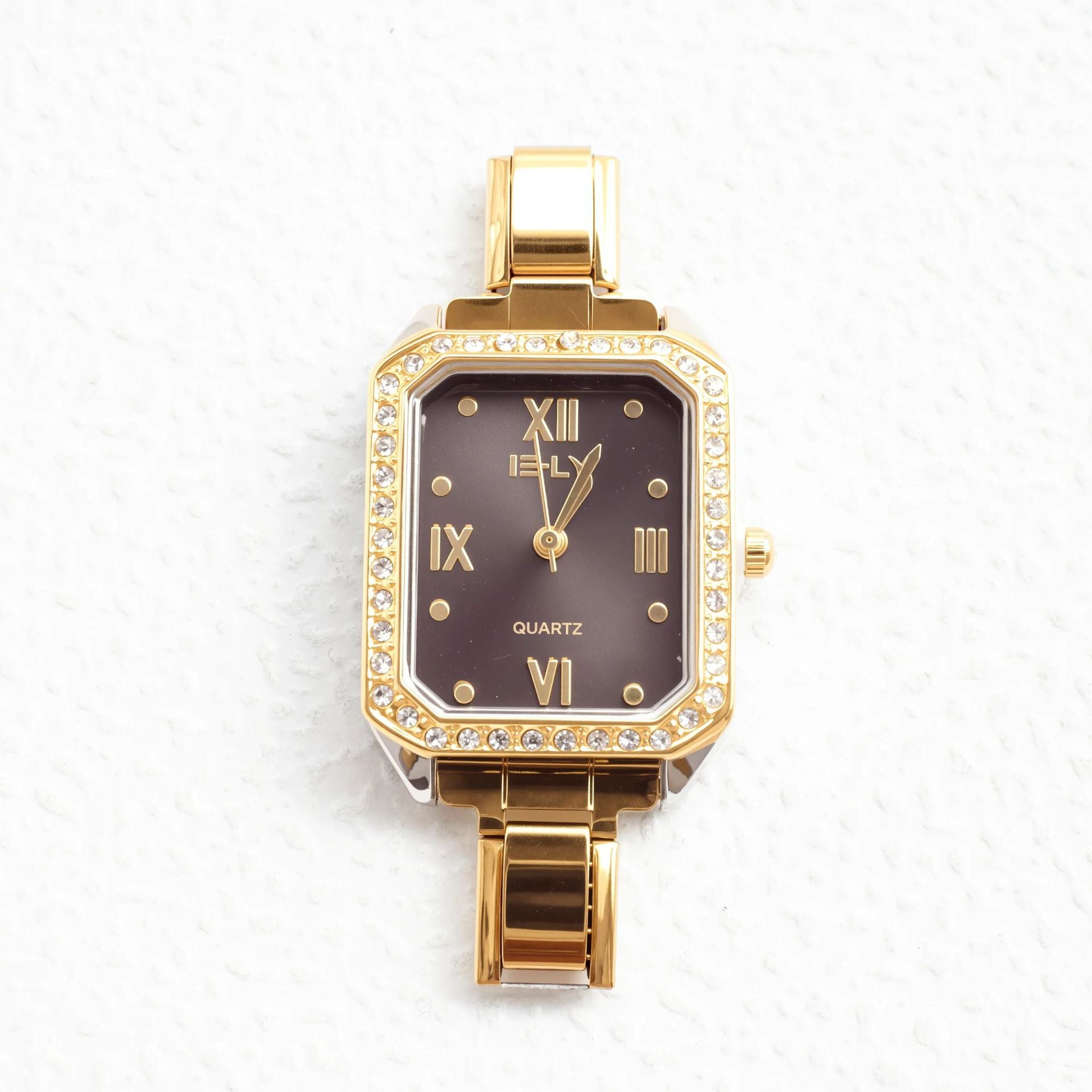 Wholesale quartz gold-rimmed diamond-encrusted watch.