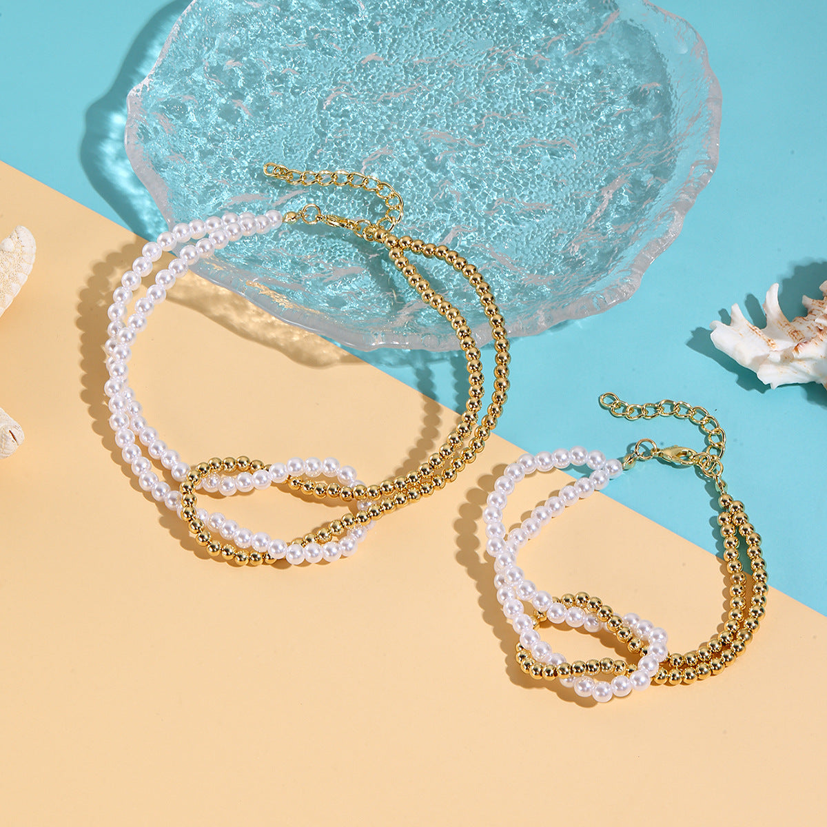 Wholesale  best-selling trendy pearl heart necklace and bracelet set for women  featuring a luxurious and sophisticated ocean-themed design