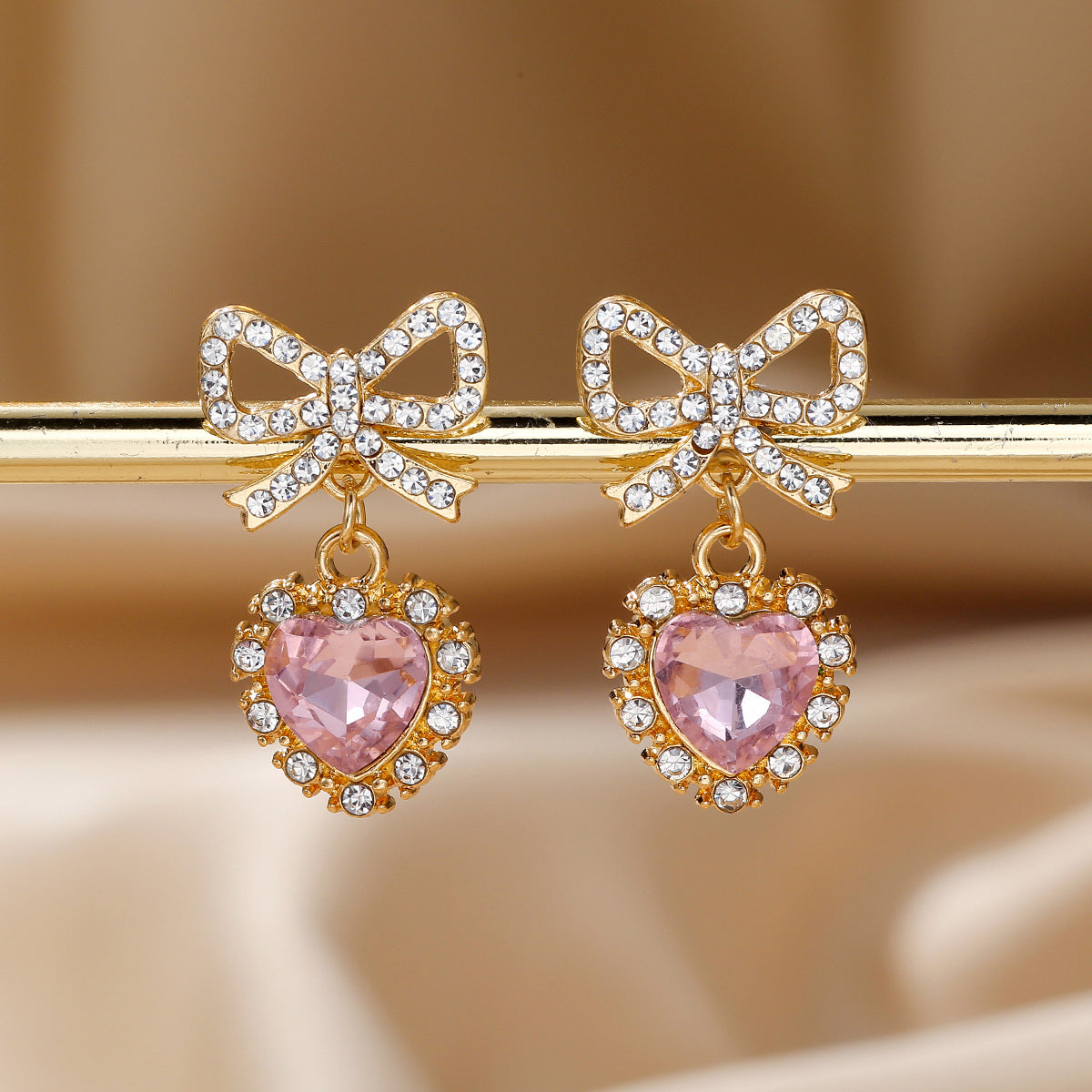 Wholesale Zinc alloy heart-shaped bow earrings with rhinestones