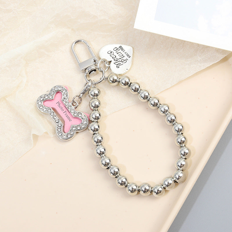 Wholesale Diamond-inlaid five-pointed star tag metal texture dog bone keychain